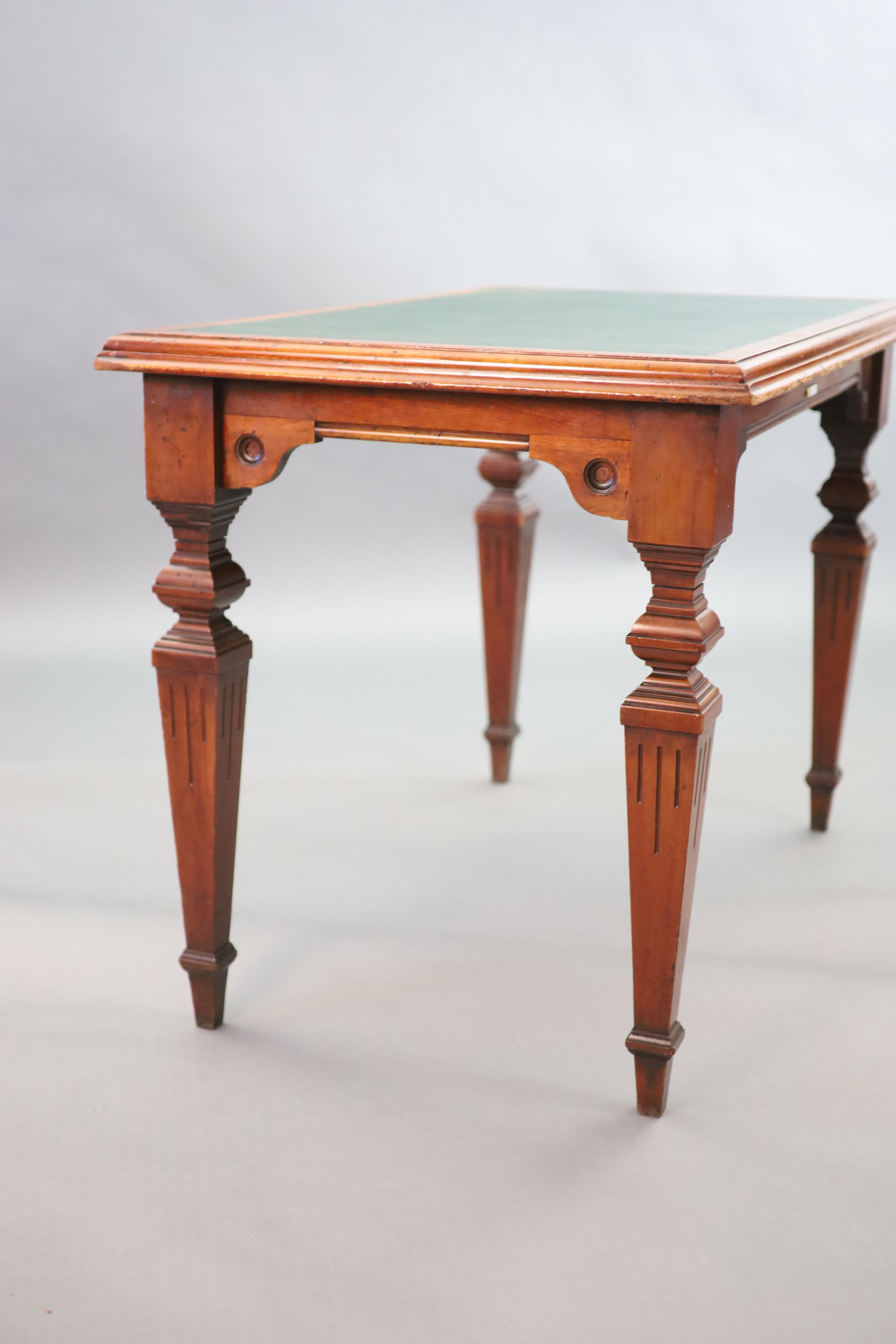 A Victorian mahogany writing table, supplied by Sage & Co. Shopfitters of London, W.112cm D.68cm H.79cm